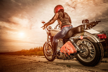 Biker girl on a motorcycle - obrazy, fototapety, plakaty