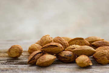 Roasted almonds on wood