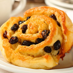 Fresh gluten free sweet swirl bun with raisins