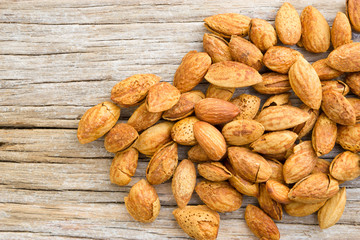 Roasted almonds on wood