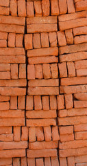 Supply of stacked orange bricks