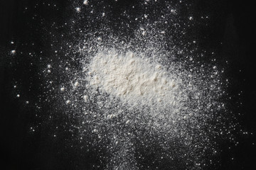 white podwer blast over black textured background  