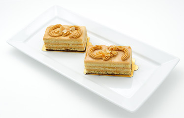 Small sponge cakes on white plate