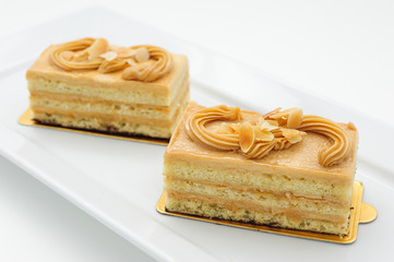 Small sponge cakes on white plate