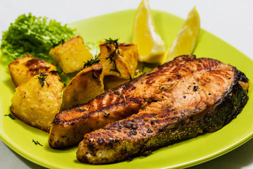 Grilled Salmon with Salad, lemon and potatoes