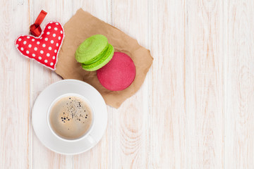 Coffee cup, colorful macarons and valentines day gift toy