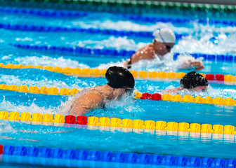 breaststroke girls swimmers in swimming race