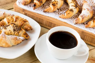 breakfast time : coffee cup with croissants