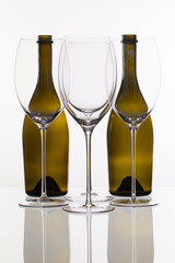 Four wine glasses and two bottle