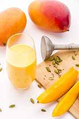Fototapeta na wymiar Mango Yoghurt Drink, Cardamon And Fruit Flesh
