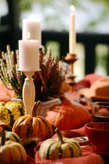 Fototapeta premium Table decoration with pumpkins and candles