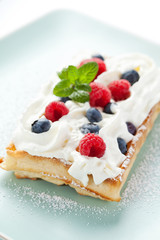 Fresh homemade brussels waffle with berries