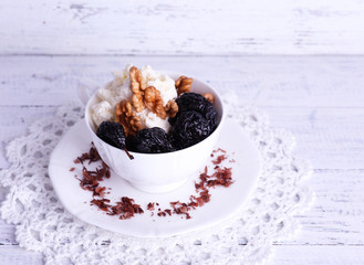 Dessert with prunes and nuts in cup