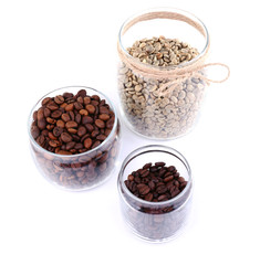 Coffee beans in glass jars isolated on white