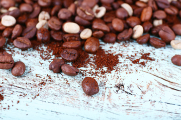 Coffee beans on light blue wooden background
