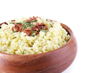 Rice with walnuts and rosemary in plate isolated on white