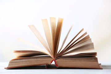 Open book on blurred bright background