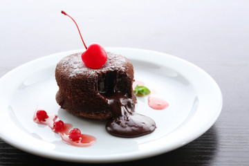 Hot chocolate pudding with fondant centre on plate, close-up