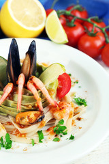 Tasty pasta with shrimps, mussels and tomatoes