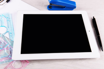 Tablet PC with geometric lines on desktop background