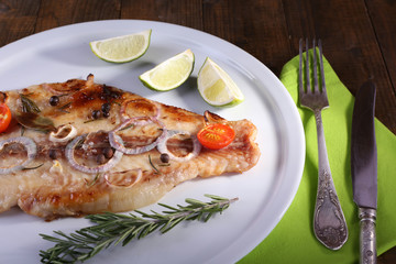 Dish of Pangasius fillet with spices and vegetables