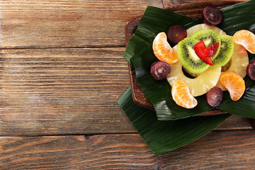 Fruit dessert on green leaf on table