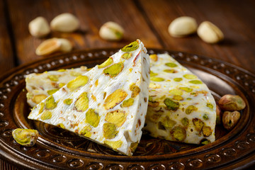 Turkish delight. Arabic dessert with and Pistachios on wooden