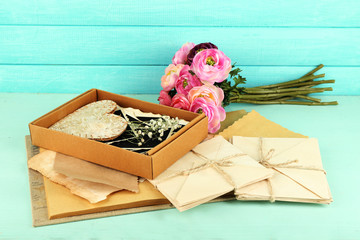 Vintage memories with flowers on wooden background