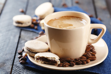 Gentle colorful macaroons and  coffee in mug