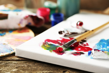 Professional art materials on wooden background
