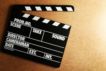 Movie clapper on wooden background