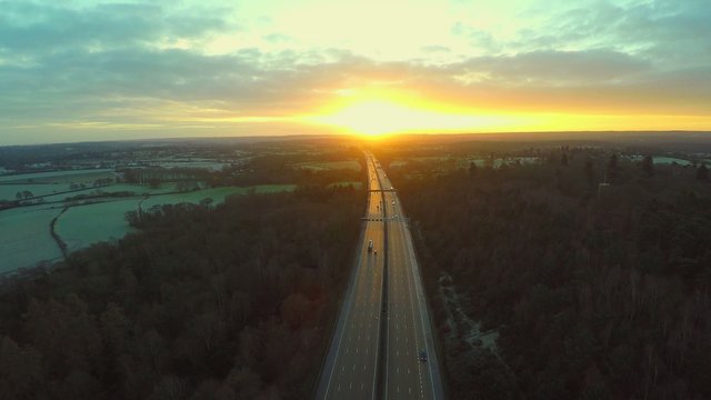 Aerial view of a truck and other traffic driving along a road  