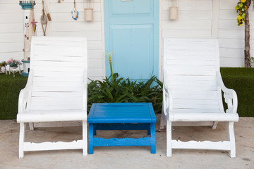 Fototapeta na wymiar white chairs and blue table.