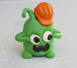 green monster with a orange helmet