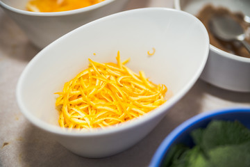close up of a bowl of orange zest