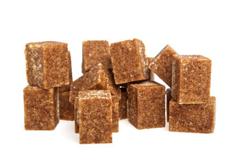 Brown sugar cubes on a white background