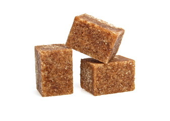 Brown sugar cubes on a white background