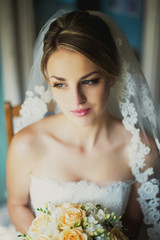 beautiful bride sitting in a room