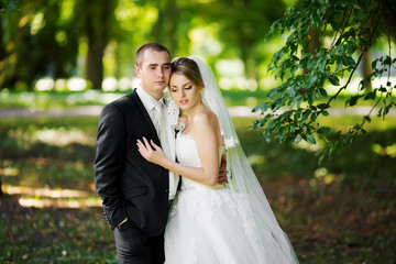 Elegant bride and groom posing together