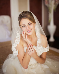 beautiful bride sitting in a room