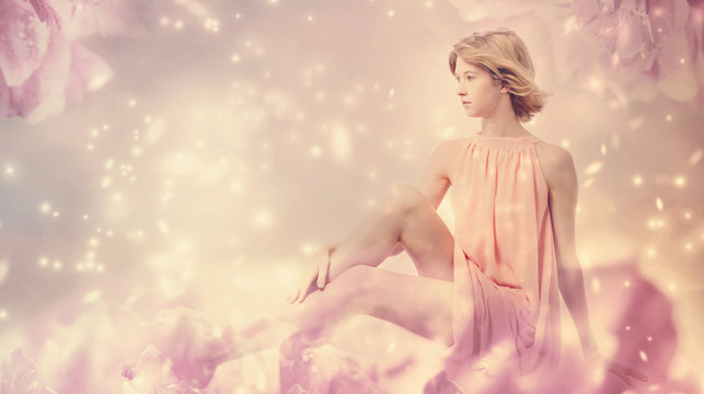 Beautiful woman posing in a pink peony fantasy