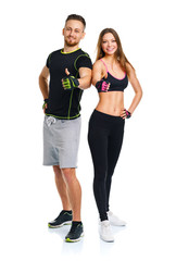 Athletic man and woman after fitness exercise with a finger up o