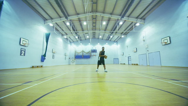 Basketball player scoring 3 point jump shot in slow motion