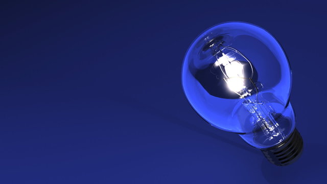 Close Up Of Electric Bulb On Blue Text Space