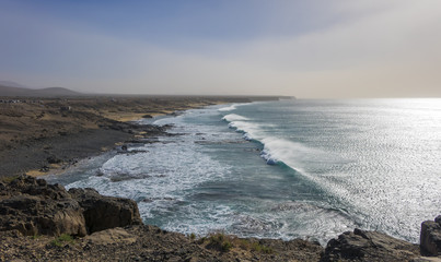 Fototapeta na wymiar Strong waves on the surfing beach in El Cotillo Fuerteventura La
