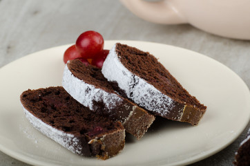 Chocolate cake with strawberries and grapes