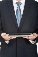 Close up on male hands holding digital tablet