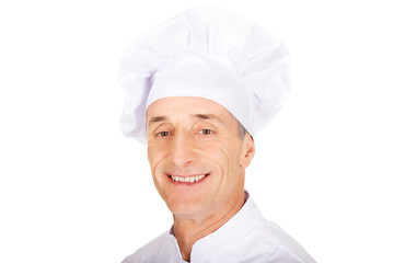 Professional chef in white uniform and hat