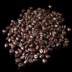 Roasted coffee beans on black background for advertising