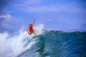 Fototapeta premium Surfer on Amazing Blue Wave